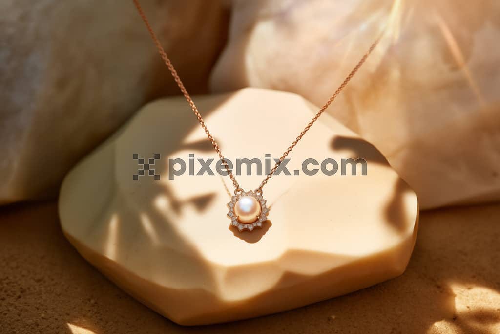 A beautiful and elegant necklace with a beautiful pearl surrounded by rhinestones pendant image.