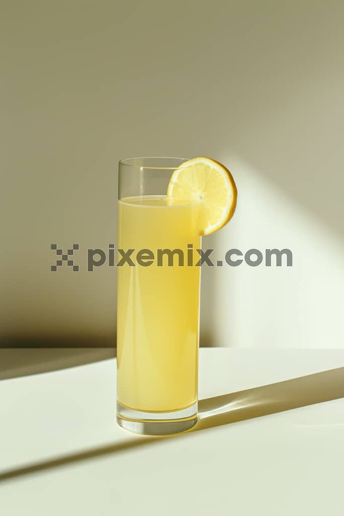 A tall glass of delicious and fresh lime juice styled with a slice of lime on top of the glass image.