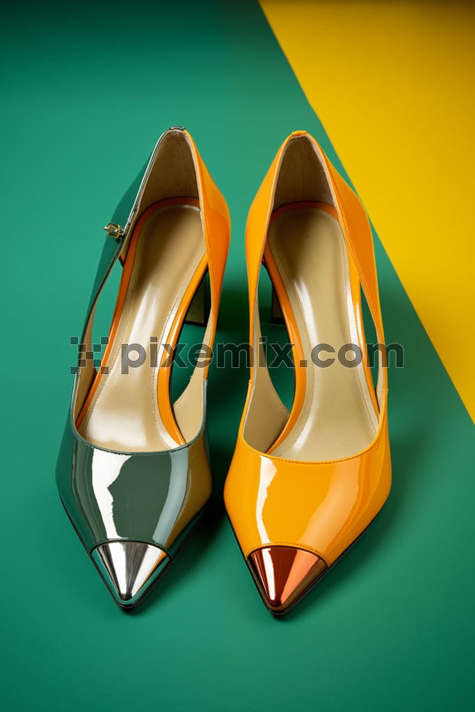 A pair of stylish shoes in green and yellow colour image.