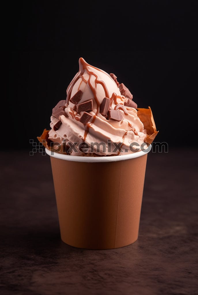 A chocolate cup cake topped with whipping cream, chocolate and caramel sauce image.