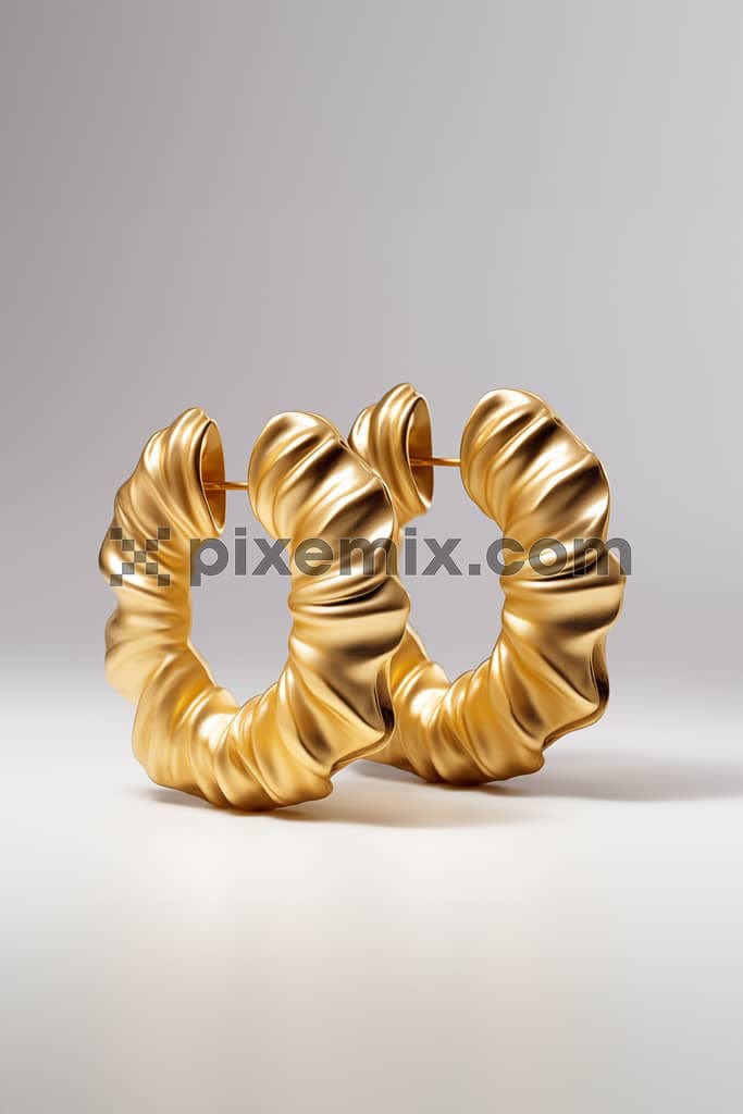 An image of an elegant golden hoop earrings displayed on a neutral background.