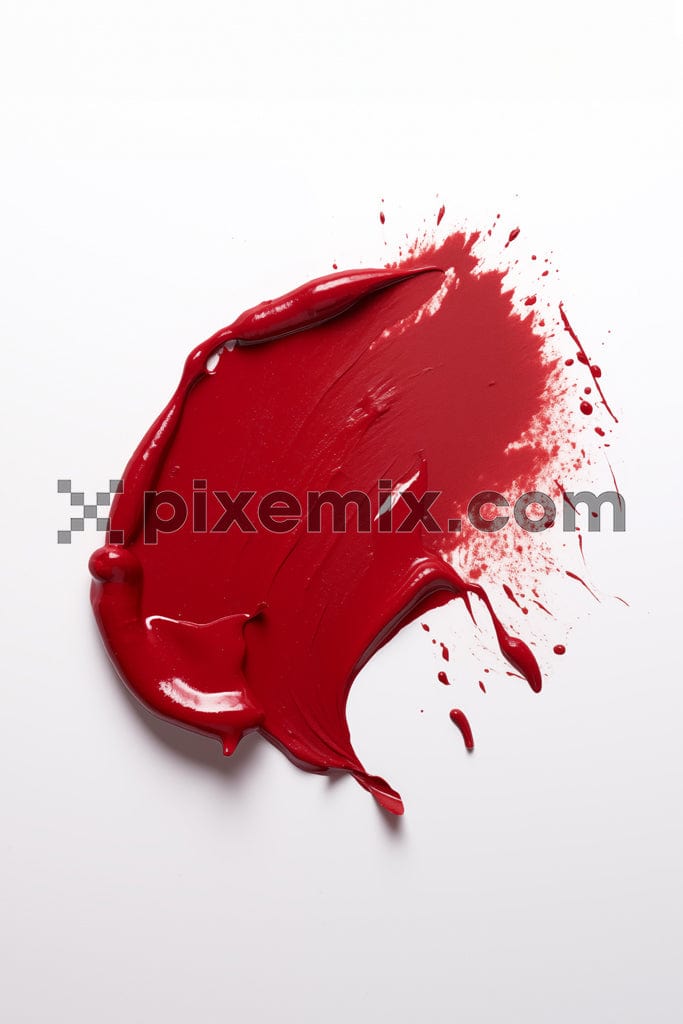 Smudged red lipstick on white background image.
