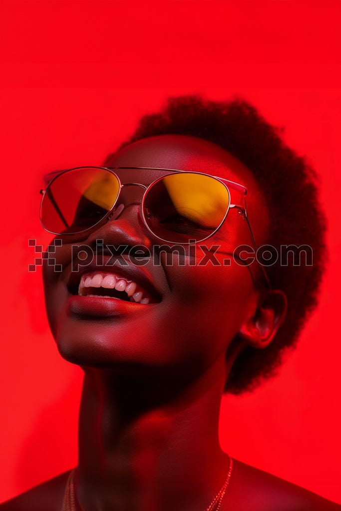 Portrait of smiling african american woman wearing sunglasses having fun on red background image.