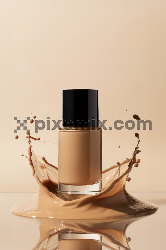 Liquid foundation bottle on splash of brown foundation cream image.