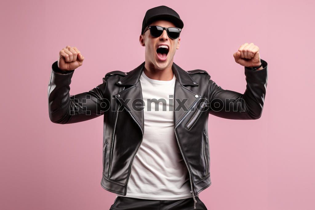 Young handsome man wearing black jacket standing over pink baqckground with appy and excited image.