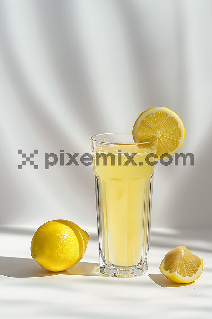 Lemon juice and fresh lemon on white background image.