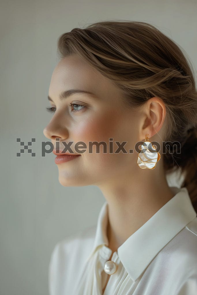 Portrait of a stylish young woman with earring on white background image.