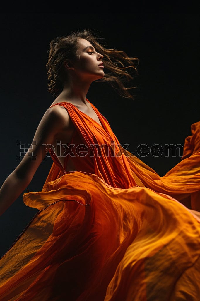 Young women in orange dress on black background image.