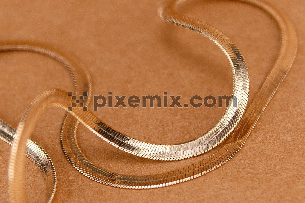 Gold chain on paper background image.