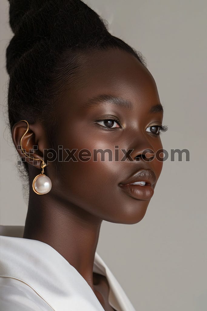 Beauty portrait of black woman with pearl earrings jewelry image.