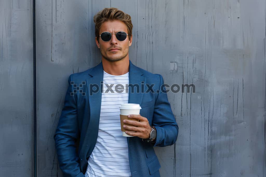 Young business man wear formal blue suit white t-shirt hold takeaway delivery craft paper brown cup coffee image.
