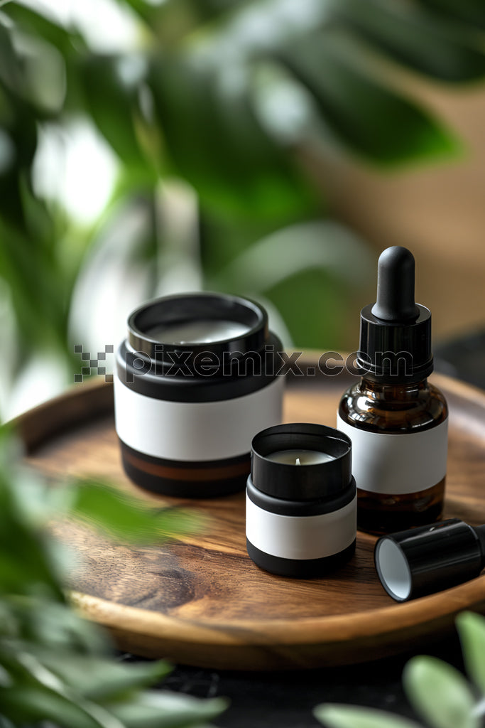 Natural skincare products in amber glass bottles on wooden tray surrounded by lush green plants.