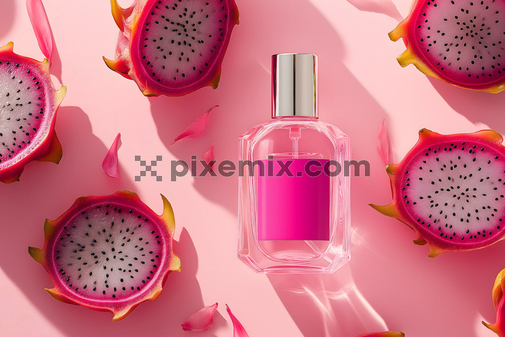 Pink perfume bottle with dragon fruit slices and petals on pastel background in tropical beauty concept.
