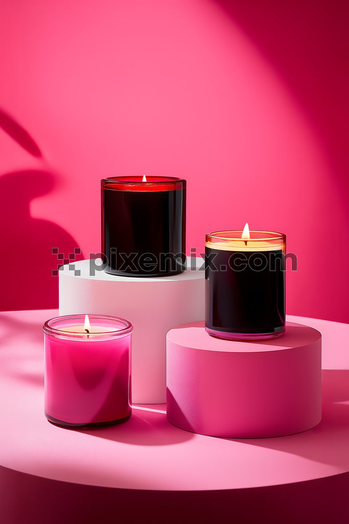 Elegant aromatic candles in pink and red glass jars on geometric podiums with vibrant background stock image.