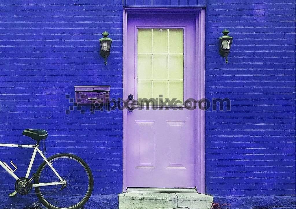 Blue brick wall background with door and bicycle in the image