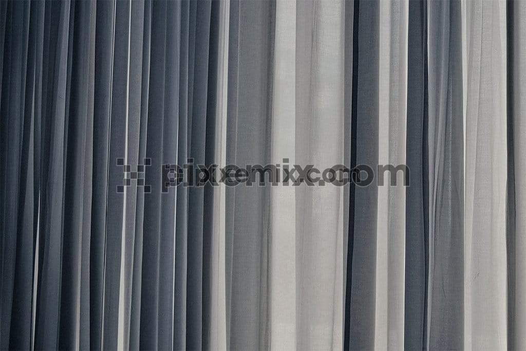 Vertical stands of tonal textile fabric bundles image