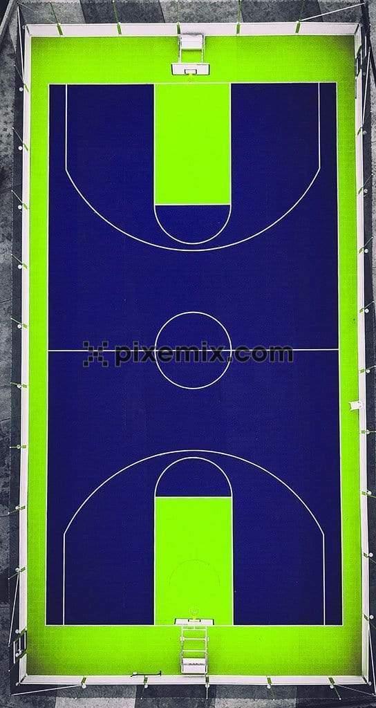 Bird eye view of neon green and blue colored basket ball court