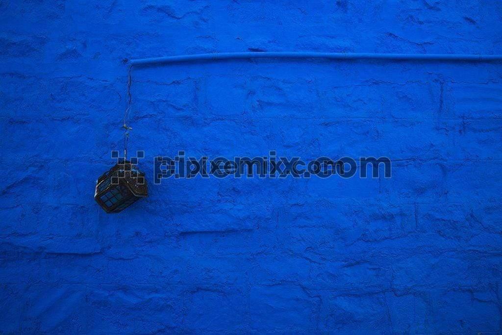 Grunge blue wall with rusted wall light contrast image