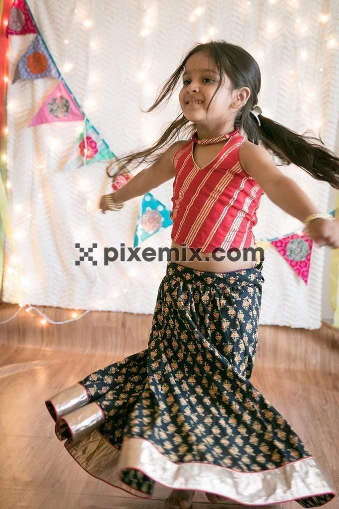 Girl dancing wearing traditional dress image
