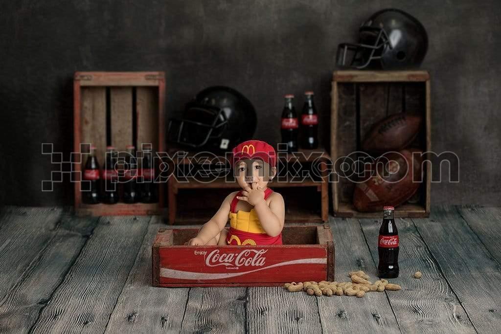 Cute little kid sitting on old cocacola wooden crate image