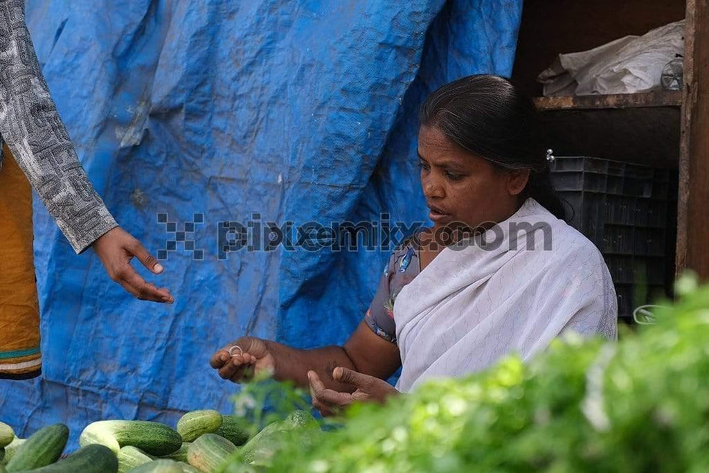 Fruit vendor selling vegetable at market