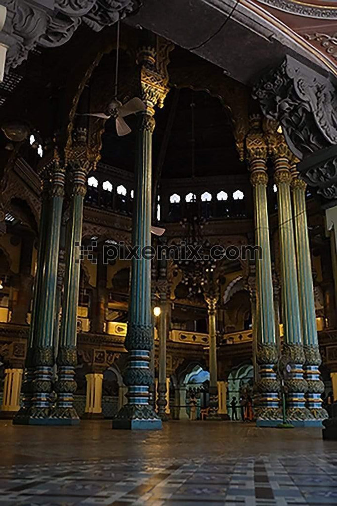 Huge heavily detailed pillars inside the mysore palace hall