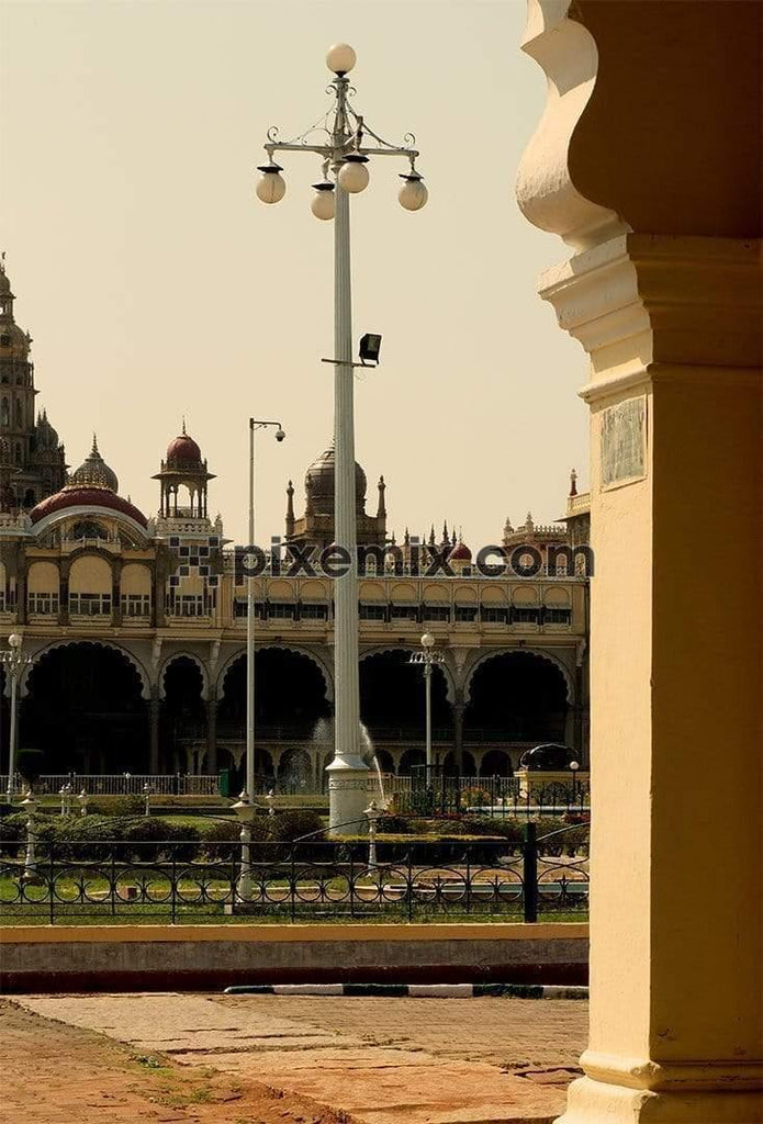 Garden lawn out side mysore palace with huge electric light pole with palace in background
