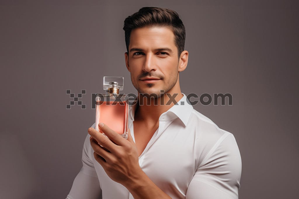 An attractive man in white shirt holding up a bottle of perfume image.